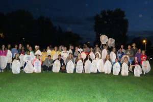 Waldorf students and faculty honoring the fallen of 9:11 with lanterns .